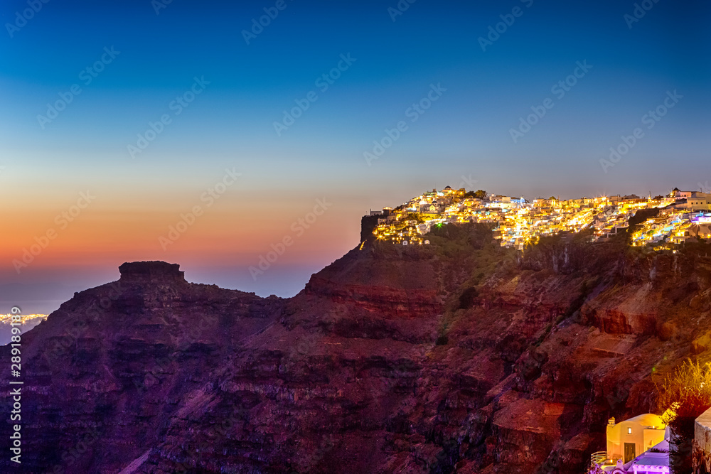 Panorama View of City of thira Located on Volcanic caldera Mountains on Santorini island. Shot During Golden Hour