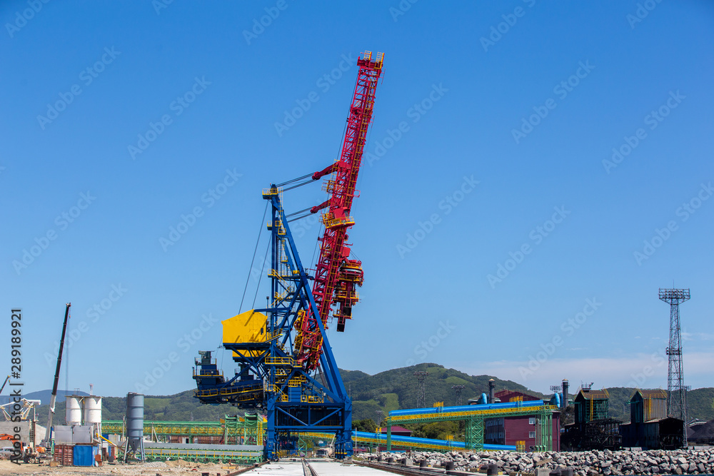 Construction cranes on the territory of the marine coal terminal. Construction cranes on the territory of the marine coal terminal.