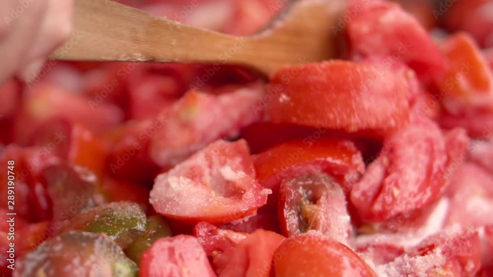 Cooking tomato sauce close-up. Cooking fresh tomato in pan, slow motion . Cooking tomato sauce close-up. Cooking fresh tomato in pan, slow motion .