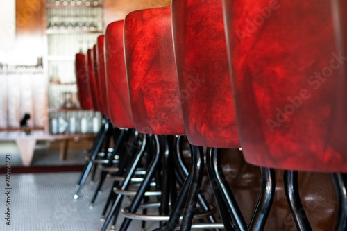 Closeup on the red bar chairs of a restaurant in Vancouver