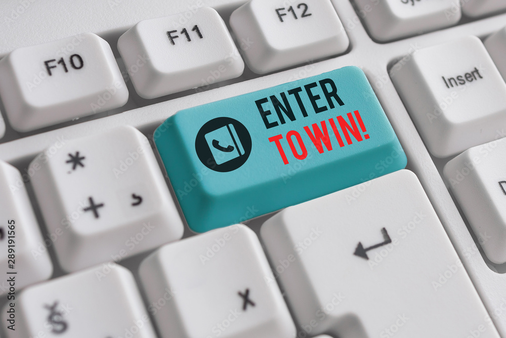 Writing note showing Enter To Win. Business concept for exchanging something value for prize chance winning prize White pc keyboard with note paper above the white background Writing note showing Enter To Win. Business concept for exchanging something value for prize chance winning prize White pc keyboard with note paper above the white background