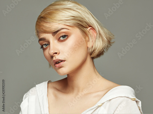 Portrait of beautiful blonde woman with short hair