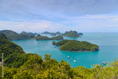 View from the viewpoint deck in Koh Wua Ta Lap, boats floating on a blue turquoise ocean and group of islands in Ang Thong National Marine Park in the Gulf of Thailand. Surat Thani, Thailand 