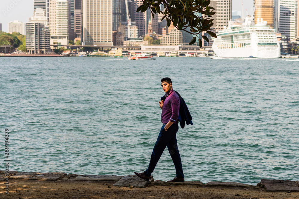 man walking along the waterfront, Sydney
