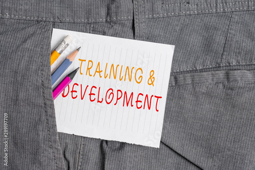 Word writing text Training And Development. Business photo showcasing learn specific knowledge to improve perforanalysisce Writing equipment and white note paper inside pocket of man work trousers