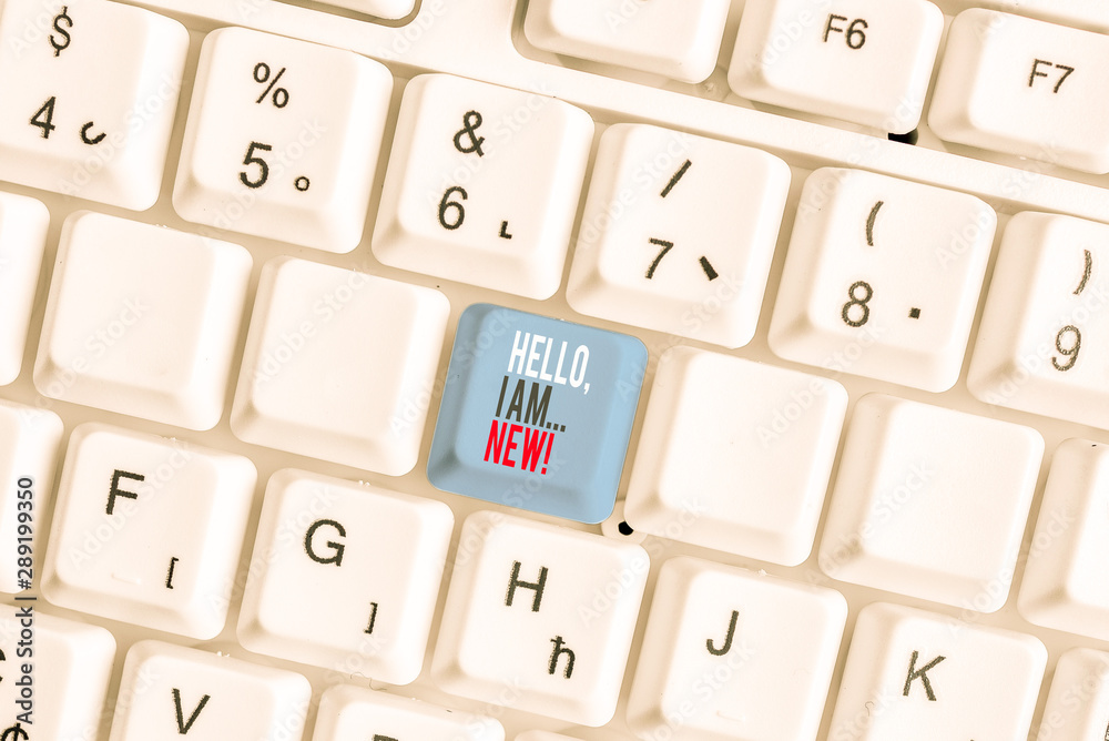Writing note showing Hello I Am New. Business concept for used greeting or begin telephone conversation White pc keyboard with note paper above the white background Writing note showing Hello I Am New. Business concept for used greeting or begin telephone conversation White pc keyboard with note paper above the white background