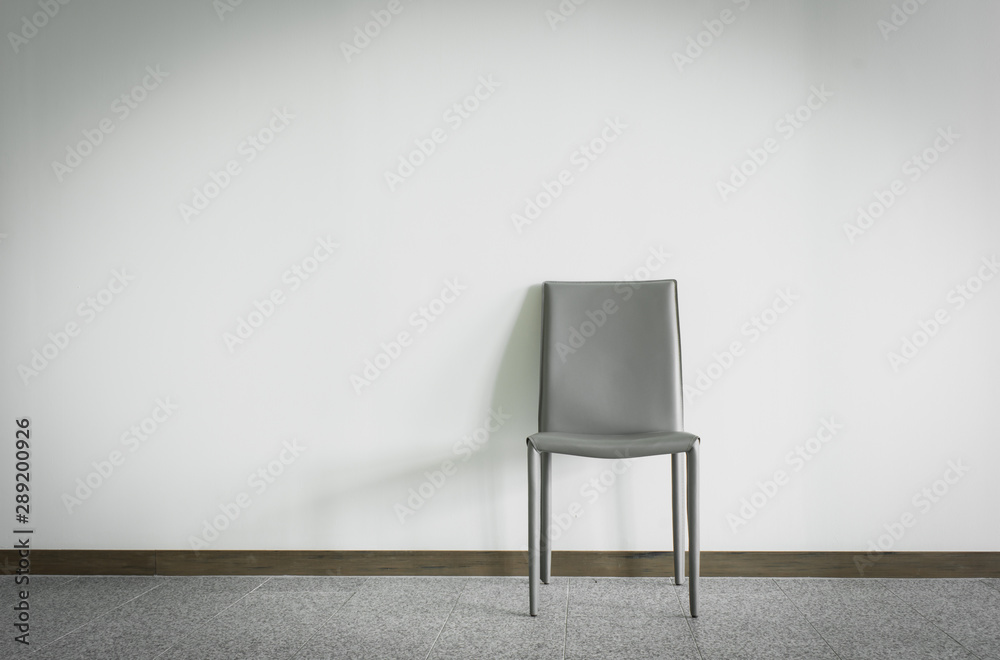 Chair with wall background and copy space.
