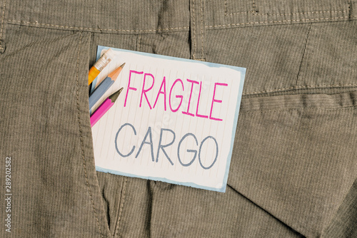 Handwriting text Fragile Cargo. Conceptual photo Breakable Handle with Care Bubble Wrap Glass Hazardous Goods Writing equipment and white note paper inside pocket of man work trousers