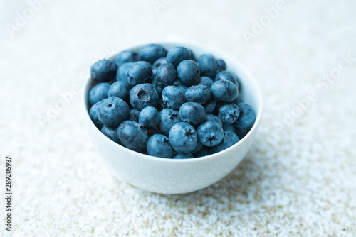 Fresh ripe blueberries in a bowl, vintage look 