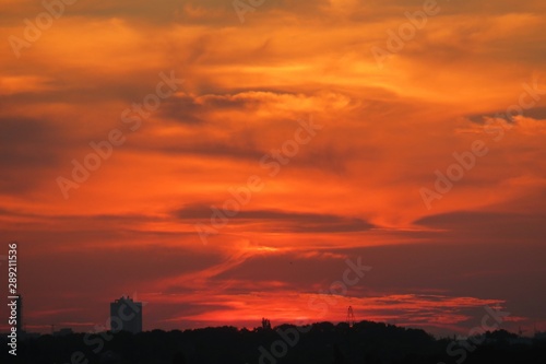 Beautiful fiery orange sunset over the city  natural background