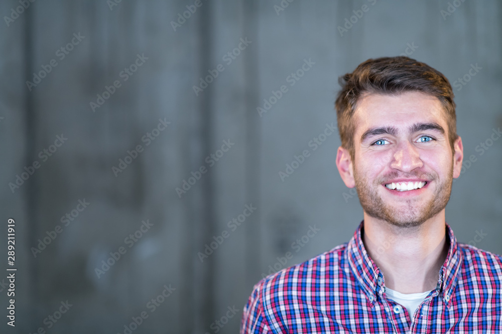 portrait of casual businessman in front of a concrete wall portrait of casual businessman in front of a concrete wall