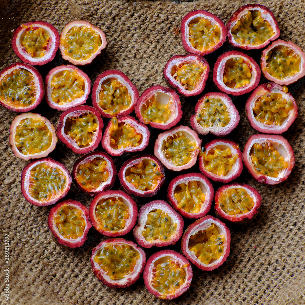 passion fruits cut in half in heart shape background passion fruits cut in half in heart shape background