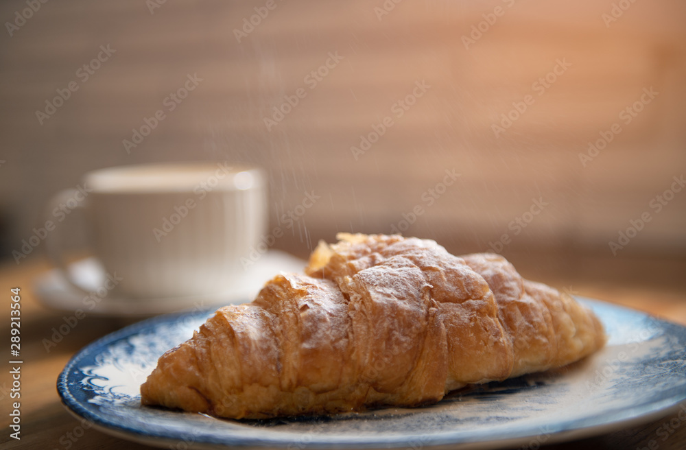 Bread on wooden table with copy space background. Breakfast morning in vintage style.