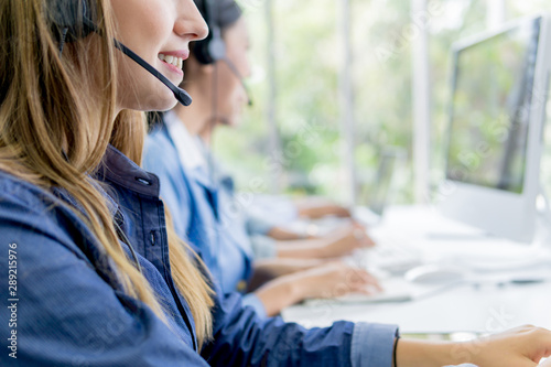 Group of call center operators at work - Call center and customer service concept.