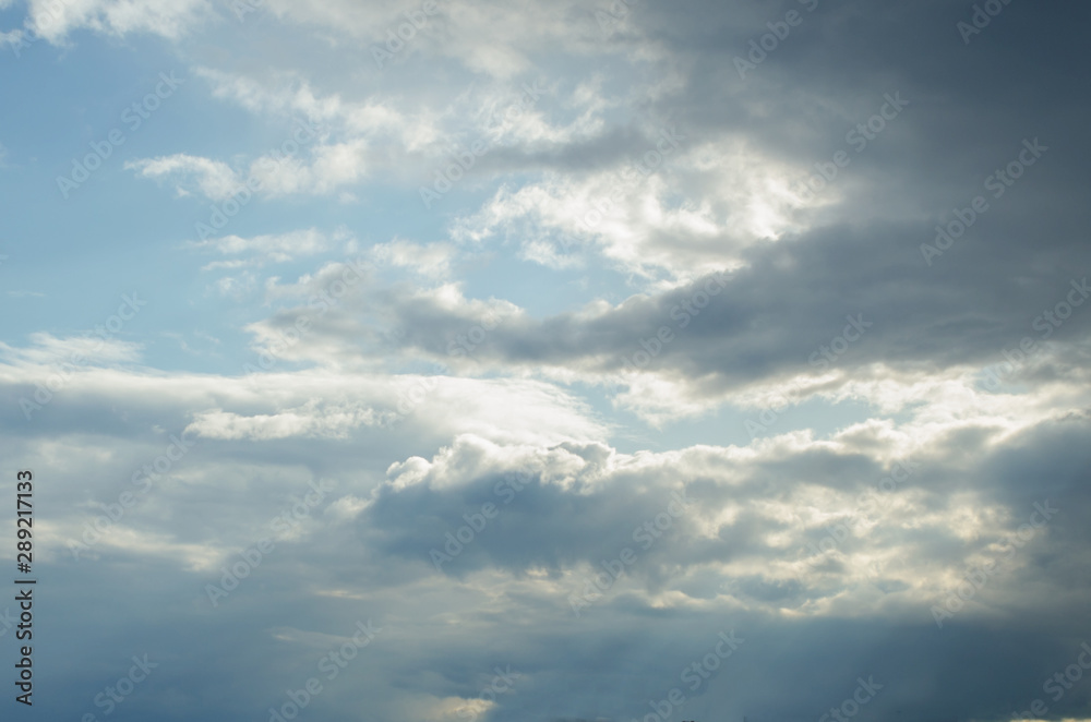 Clouds in the blue sky with breaking light Clouds in the blue sky with breaking light