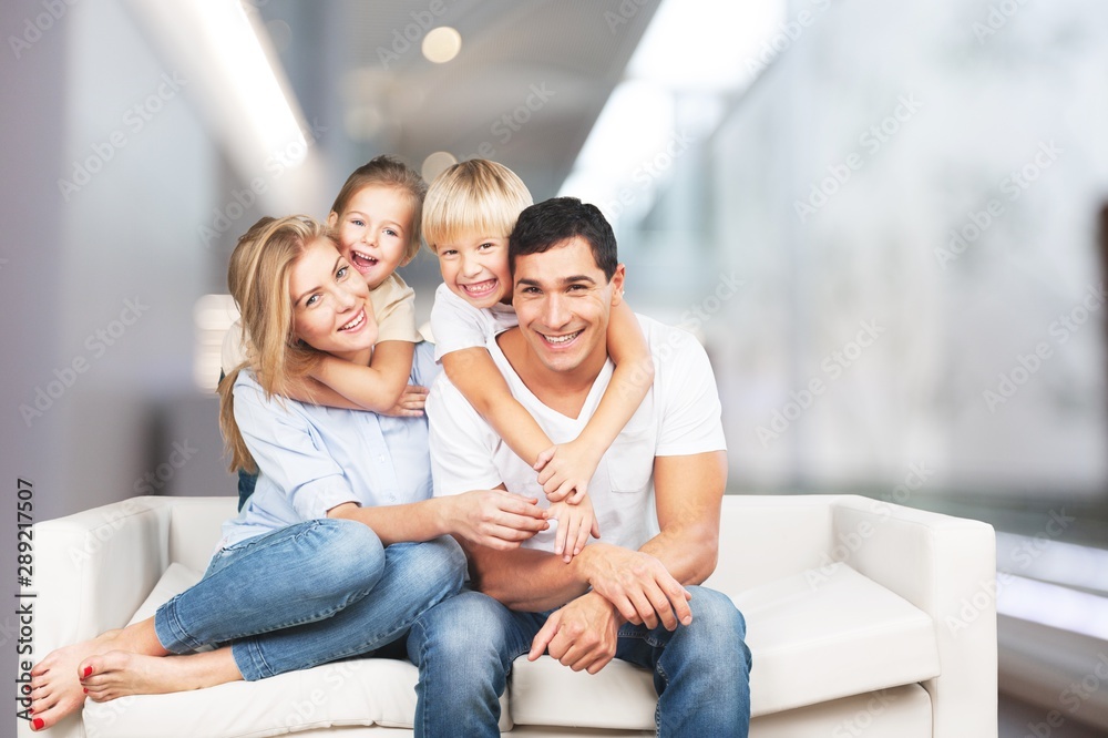 Young family at home smiling at camera Young family at home smiling at camera