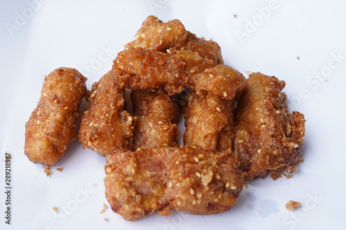 Banana fry in a pan with boiling oil. When finished, looks very appetizing