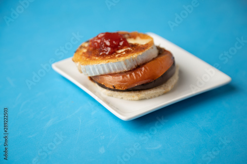 Goat cheese with mushroom and tomato, typical Spanish tapa