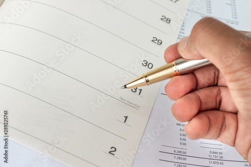 The calendar in the notebook on the desk