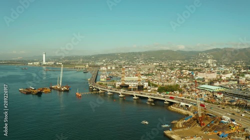 Panorama of Cebu in the morning. Road bridge and seaport, view from above. The coastal part of the city of Cebu, Philippines.