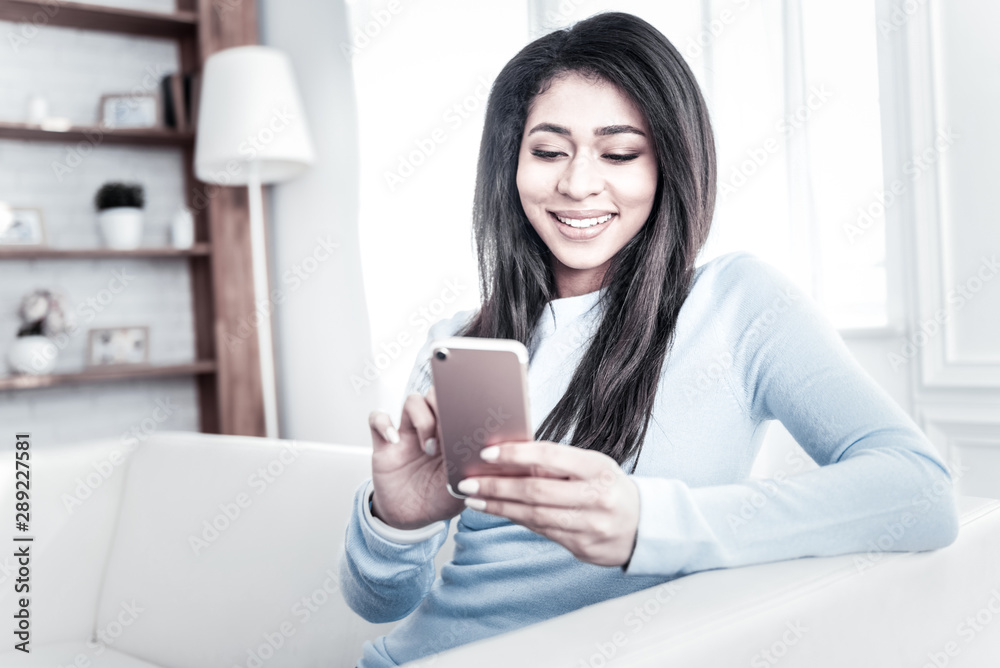 Long-haired girl with white teeth and pretty smile amusing herself Long-haired girl with white teeth and pretty smile amusing herself