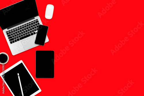 Flat lay of office table with laptop computer, digital tablet, mobile phone and accessories.