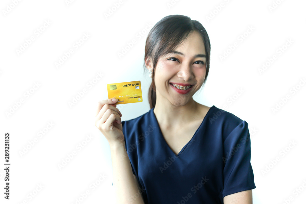 Portrait Asia smiling woman with credit card in hand,happy to have money concept. Portrait Asia smiling woman with credit card in hand,happy to have money concept.
