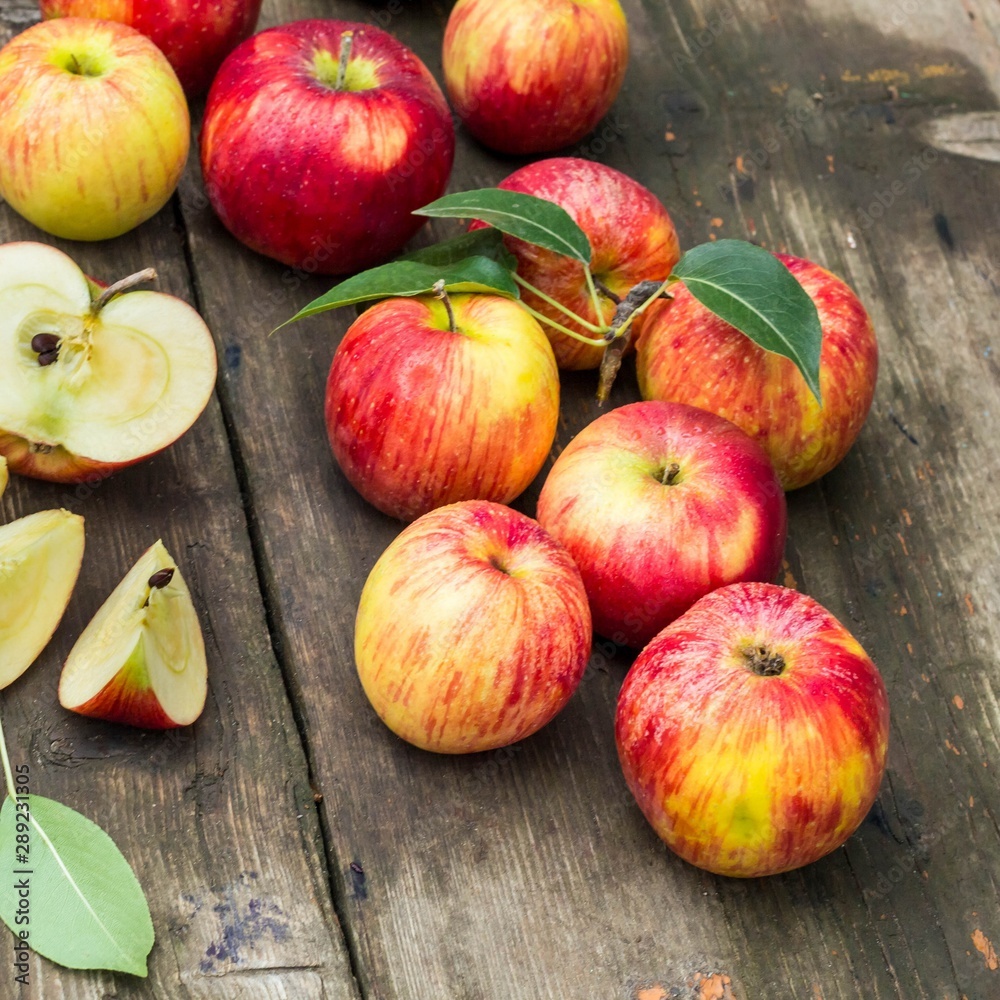 Red apple sliced and knife on old wooden table Red apple sliced and knife on old wooden table