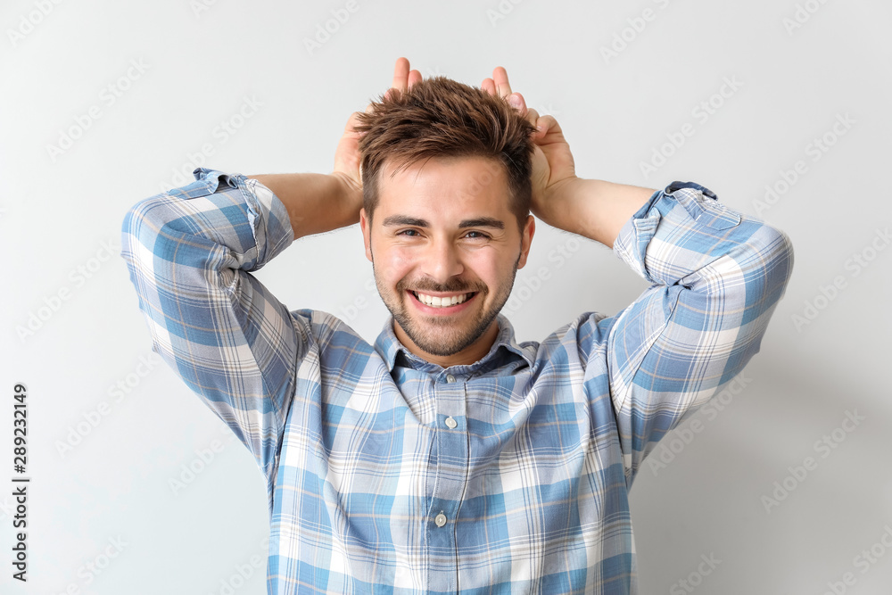 Portrait of funny young man on light background Portrait of funny young man on light background