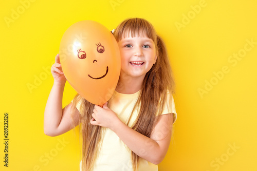 Happy little girl with draw...