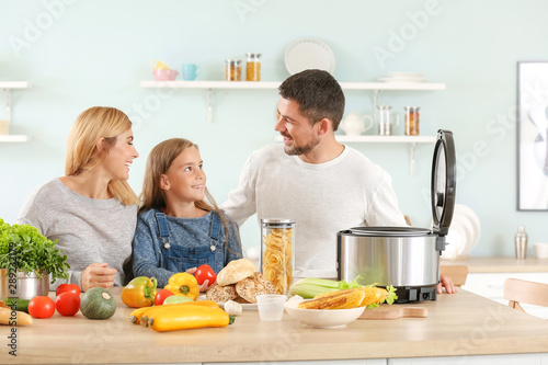 Happy family with modern mu...