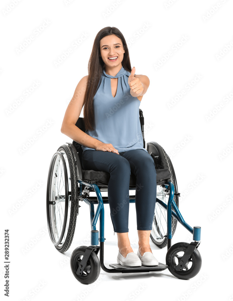 Happy businesswoman in wheelchair showing thumb-up gesture on white background Happy businesswoman in wheelchair showing thumb-up gesture on white background