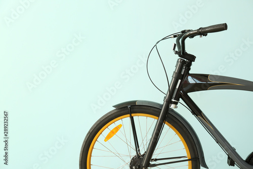 Modern bicycle on light col...