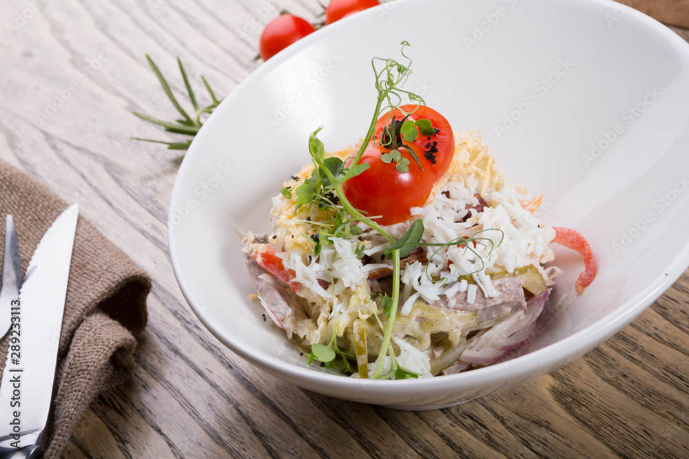 Traditional russian salad in a bowl Traditional russian salad in a bowl