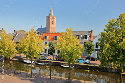 Historic houses located inside the fortified town of Naarden, Netherlands, with the clock tower of the Grote Kerk church in the background © Christophe Cappelli