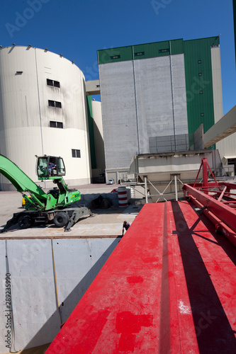 Unloading of ship. Crane. Grain storage Eemsmond Groningen Netherlands. Harbor, photo