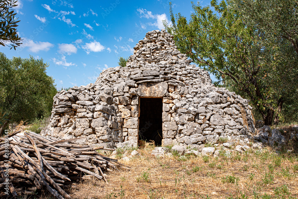 small trullo, typical building built with stones from Puglia. small trullo, typical building built with stones from Puglia.