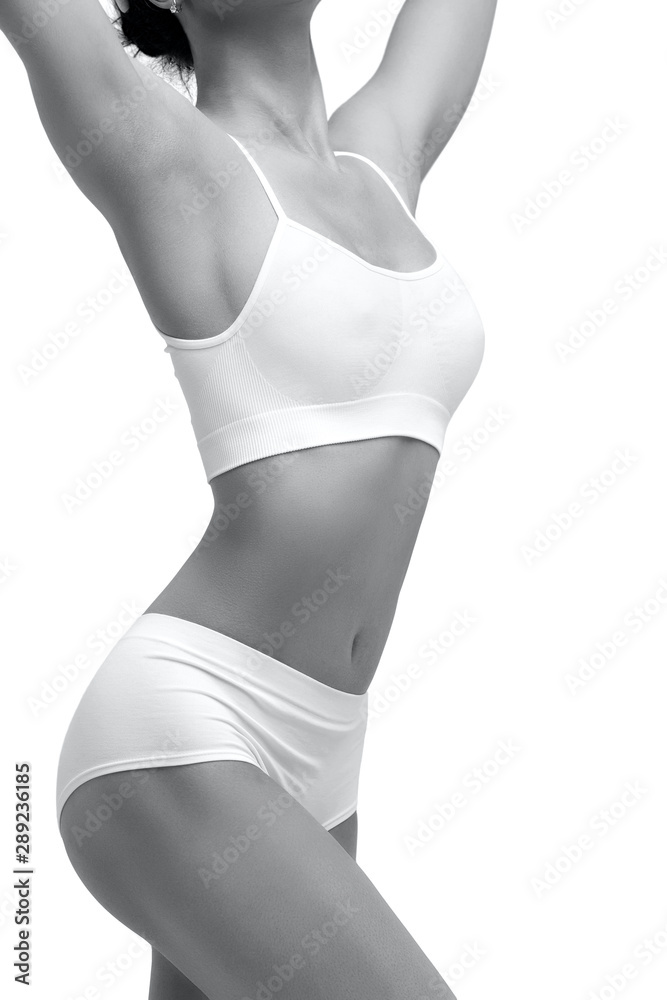 © Nobilior - Closeup shot of sexy female body. Liposuction, diet and healthy lifestyle, weight loss concept. Isolated on white background © Nobilior - Closeup shot of sexy female body. Liposuction, diet and healthy lifestyle, weight loss concept. Isolated on white background