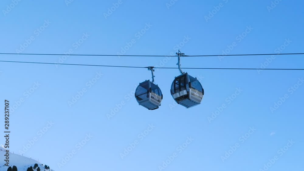 Cable car view from ground with cars passing each other, static shot Cable car view from ground with cars passing each other, static shot