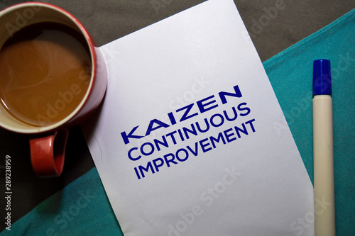 KAIZEN. Continuouse Improvement text on the paper isolated on office desk background. Japanese Concept