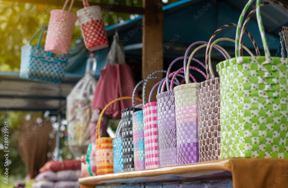 Many colorful plastic baskets in shop sheds.