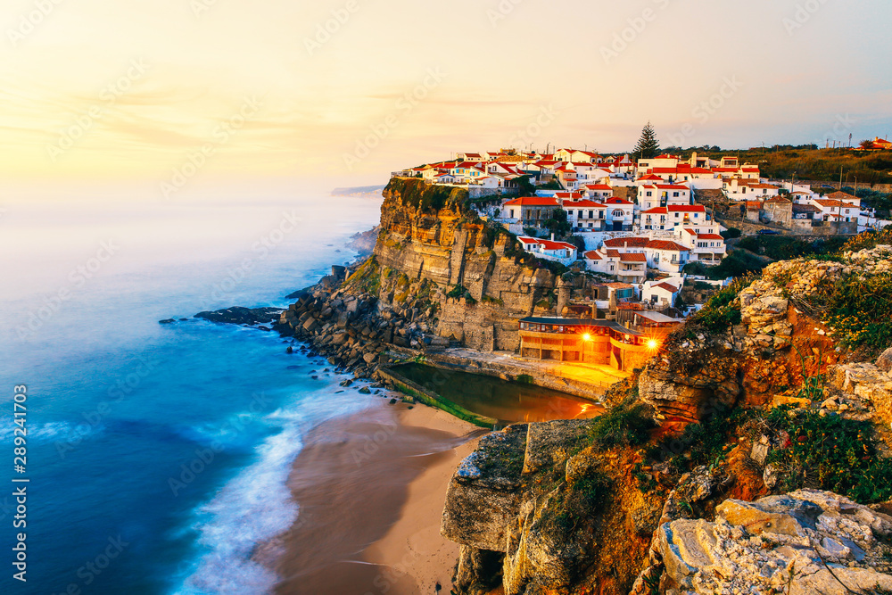 Azenhas do Mar village on a cliff in near Lisbon, Portugal at sunset, travel luxury europe vacation, famous tourist attraction, Lisbon, Portugal. 