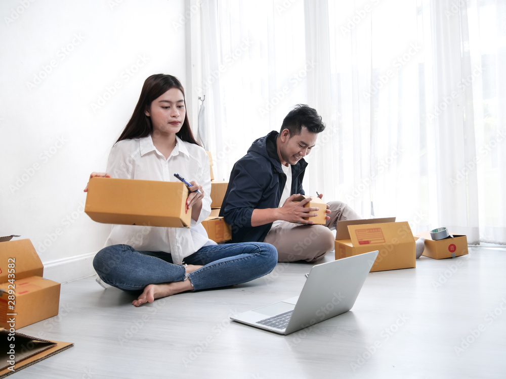 Asian couple with stack of parcel boxes, online business and delivery concept. Asian couple with stack of parcel boxes, online business and delivery concept.