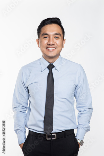 Asian man wearing business attire smiling