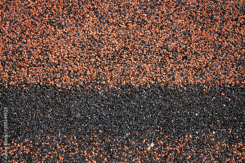 Red and black sandpaper texture macro shot background photo