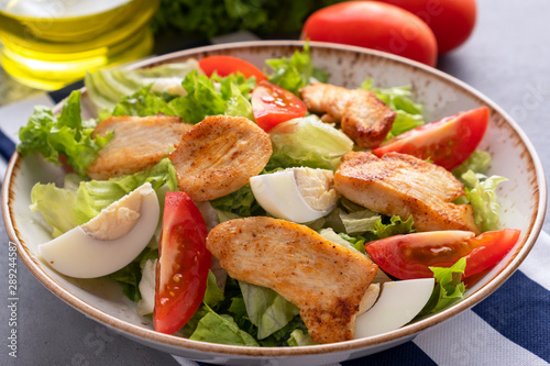 Chicken salad with fresh vegetables . Healthy food. Closeup
