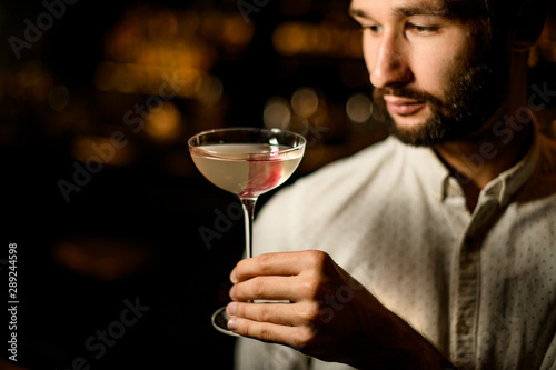 Portrait of bartender with an alcohol cocktail