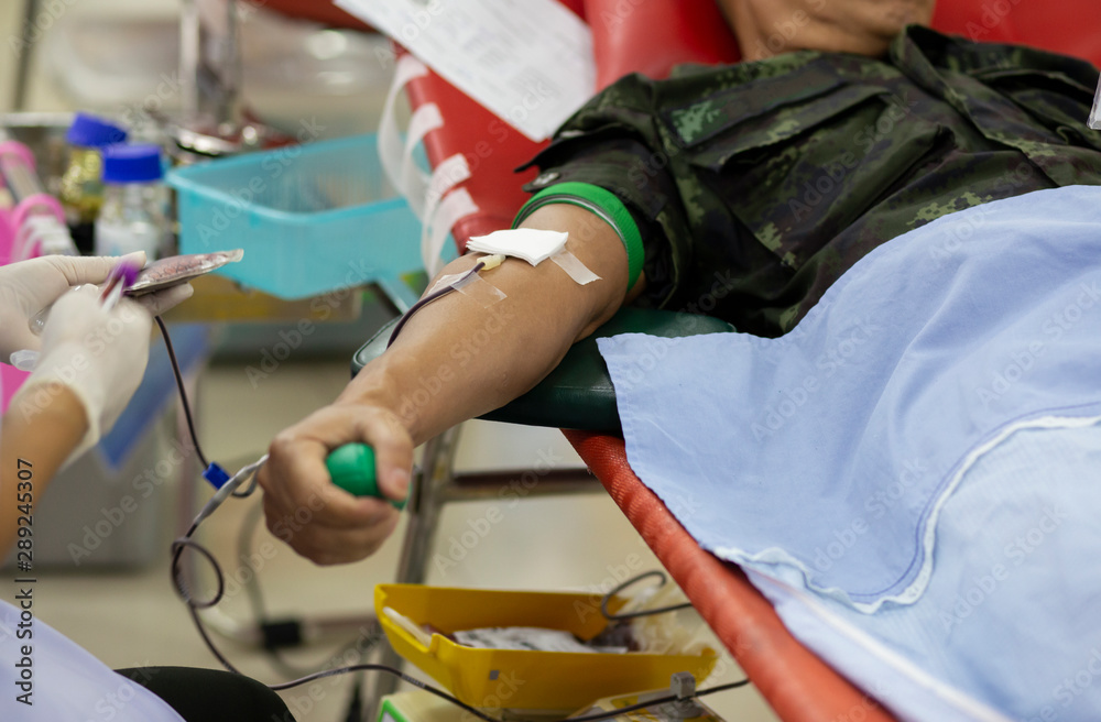 Blood donor at donation with a bouncy ball holding in hand, image for Thailand Aug 2019. Blood donor at donation with a bouncy ball holding in hand, image for Thailand Aug 2019.