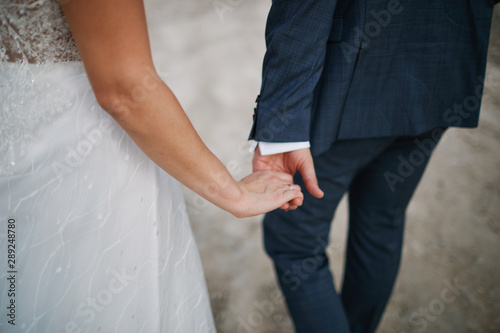 man and woman holding hands