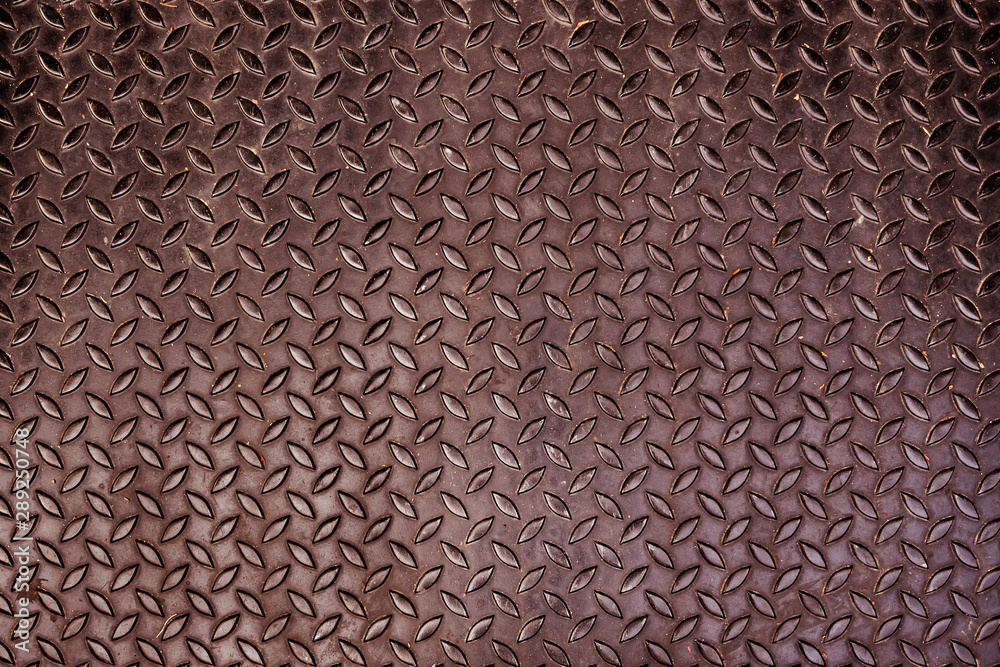Rusty metal sheet with diamond pattern Rusty metal sheet with diamond pattern